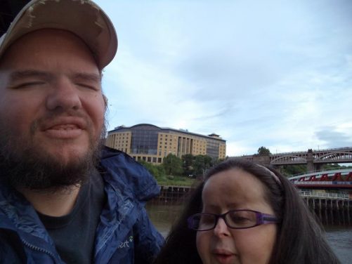 Close-up of Tatiana and Tony by the River Tyne. The High Level Bridge in view to the side.