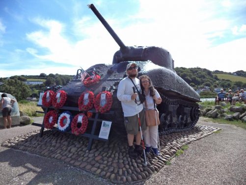 Tatiana and Tony next to a WWII US Sherman Tank, part of the Exercise Tiger Memorial